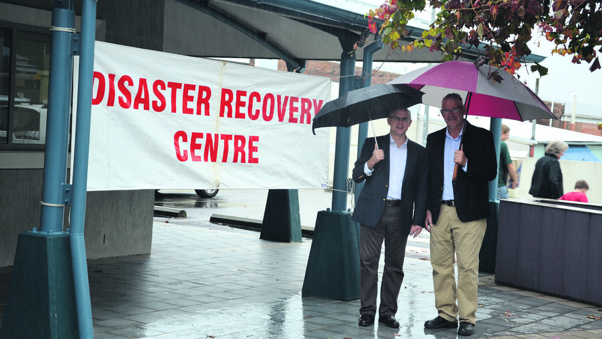 HELP AVAILABLE: Recovery coordinator, retired Brigadier Darren Naumann and Cessnock Mayor Bob Pynsent at the disaster recovery centre on Saturday.