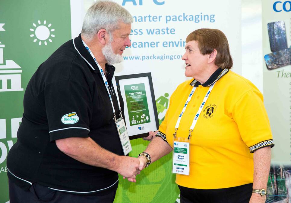 WINNER: Geoff Johnston from Biobag World Australia presenting Alison Davey from Cessnock Tidy Towns with their award.