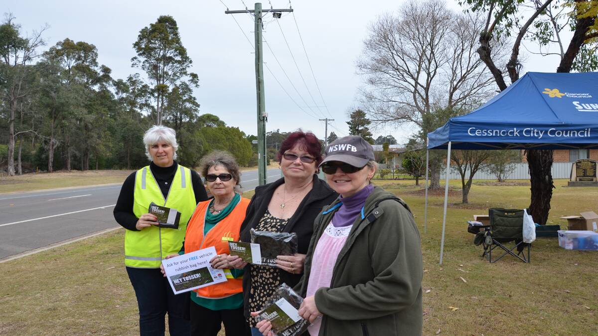 TIDY TEAM: Cessnock City Council sustainability officer Tricia Donnelly, Bernice Brown of Wollombi Tidy Valleys, Vickie Noble and Jane Parkes of Bellbird Tidy Towns at the litter blitz at Bellbird on Thursday.
