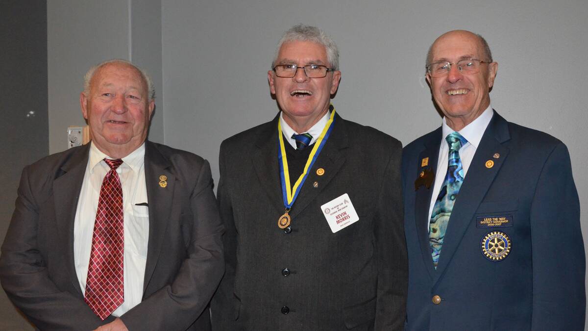 CONGRATULATIONS: Cessnock Wine Country Rotary Club secretary John Brown, incoming president Kevin Morris and Past District Governor, Ken McDonald after Mr. Morris received his Paul Harris award.