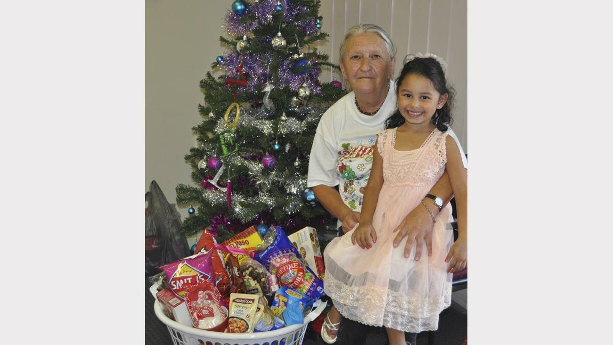 SURPRISED: Lynette Dalley and her granddaughter Charlotte with her Christmas hamper prize.