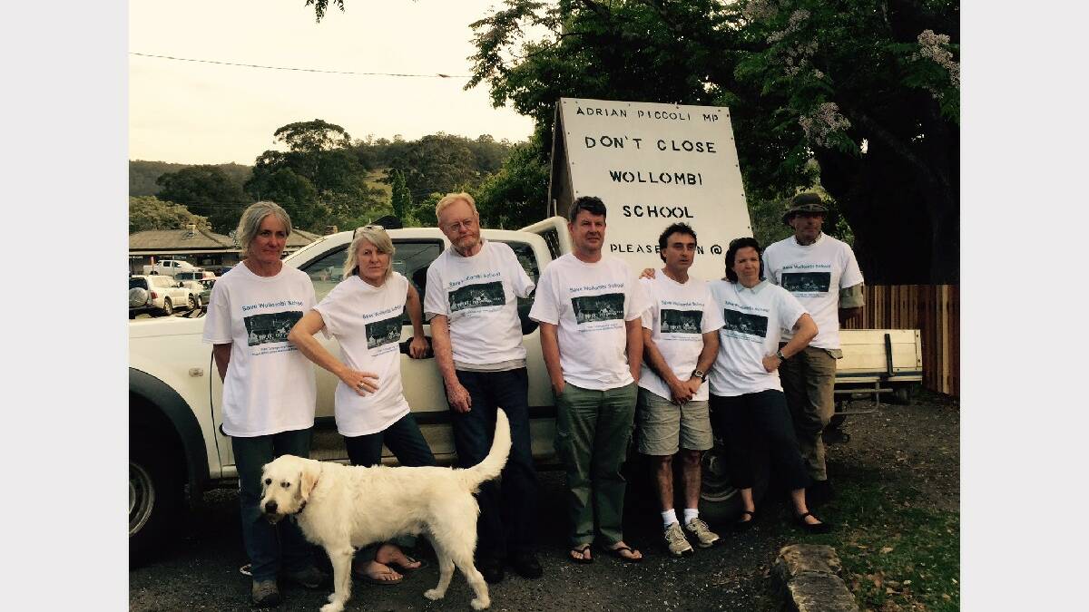 CAMPAIGNING: Wollombi Save Our School committee members Marcelle Lloyd, Kes Harper, Tony Palfreeman, Declan Ankers, Frank Ganino, Lindy Williams and Bert Burless (and their four-legged supporter Baxter).