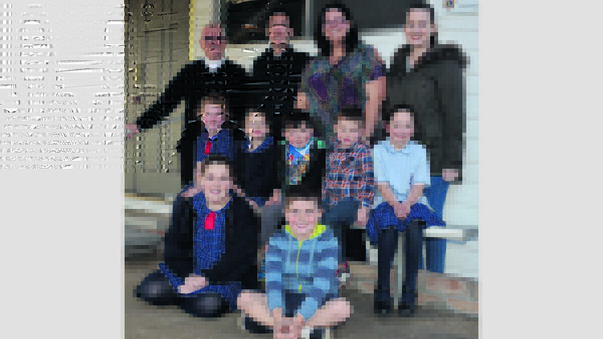 FUN AND FAITH: Back row, Fr. Tony Potts, Fr. Chris Jackson, Nicole Morrow and Jessica Laczkowski; middle, Shae Smith, Ruby James, Marcus Morrow, Jai Smith and Charlotte Morrow, and at front, Ivy Bowtell and David James, ready for Barney’s Club youth group, which will start at St. Paul’s Kurri on Thursday.