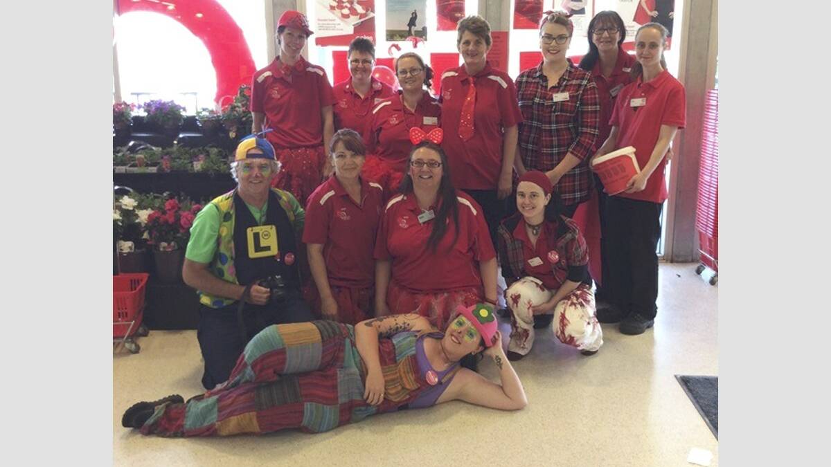 SUPPORT: Coles Kurri staff dressed in red for cancer charity Redkite on September 25.