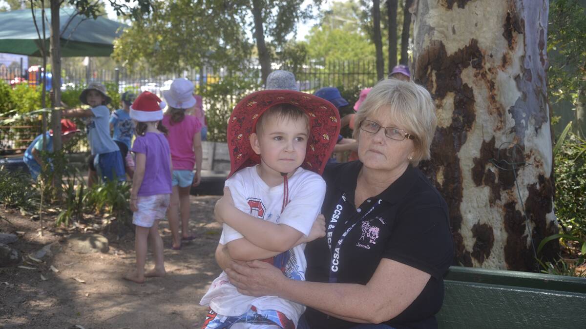 CONCERNED: Kurri and District Preschool Kindergarten pupil Riley Zammit with director Jannelle Gallagher, who said that the government’s new reforms could force  
childcare business to raise their fees. 