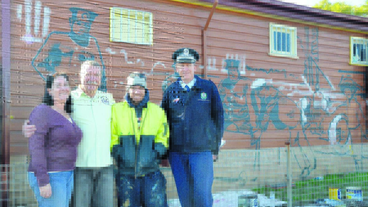 COMMUNITY HISTORY: Towns with Heart community projects manager Lesley Morris, Towns with Heart mural guide Matt Nolan, artist Ben Mellon and Inspector Glenn Blain at the site of the new mural at Kurri Kurri Police Station.