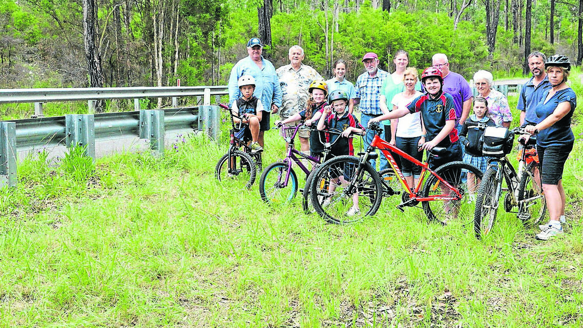 NOT GIVING UP: Local residents pictured on Kearsley Road, Abernethy, where the Abernethy Healthy Lifestyle Association wants a cycleway and bike bridge.