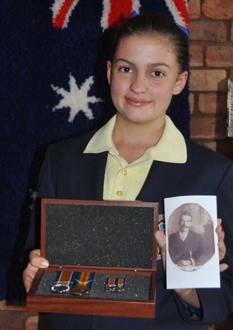 COMMEMORATION: Kurri High student Heidi Hyland with her great, great grandfather Robert Thomas Logan’s medals from WWI that she will take to Gallipoli next year