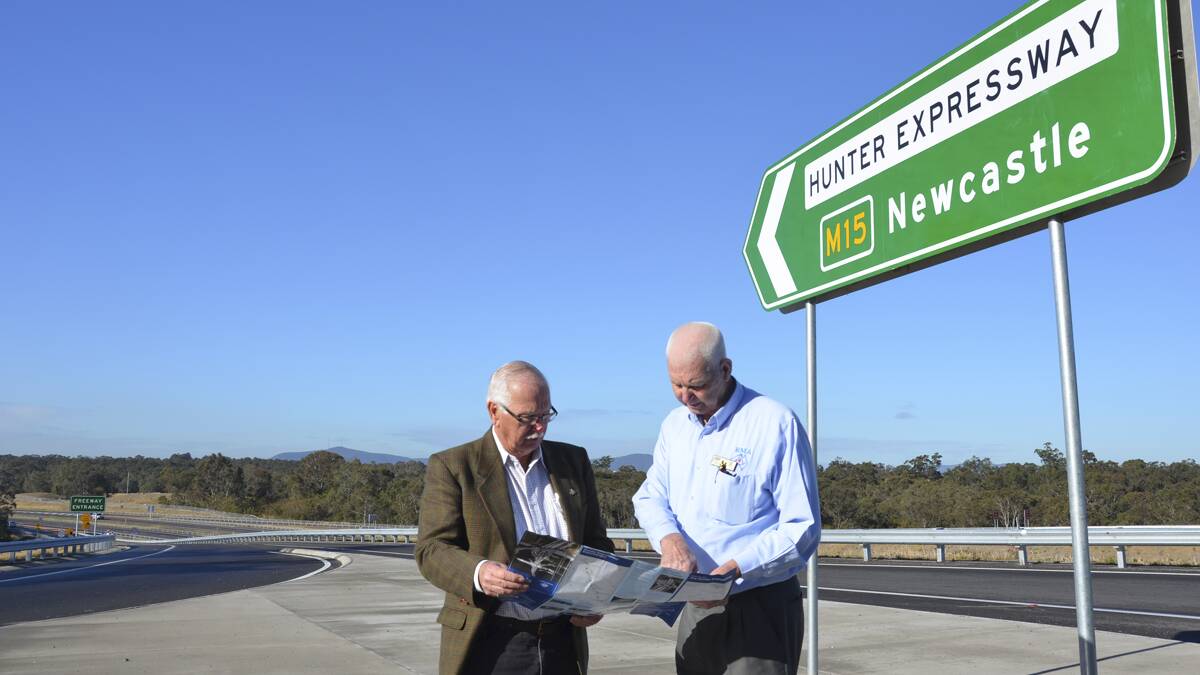 PLEASE RECONSIDER: Rod Doherty and Alan Gray at the Hunter Expressway’s Loxford interchange, which they say would provide ideal access for a new Lower Hunter hospital to be located nearby.