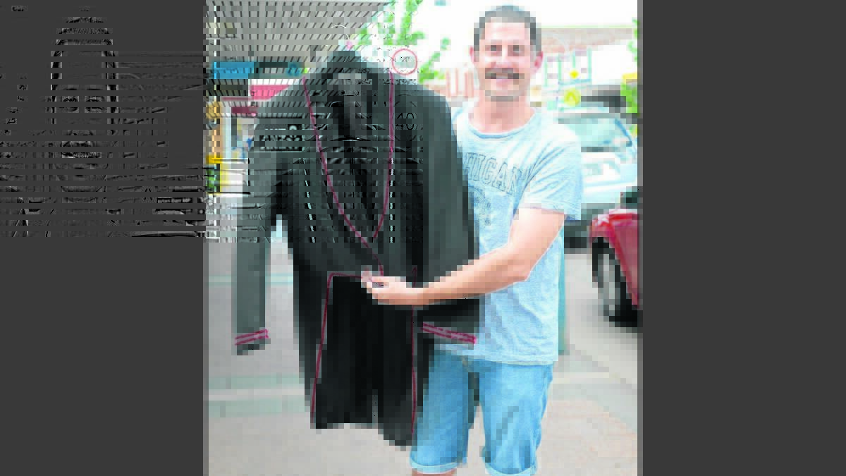 DAPPER: Josef Krauser with the jacket he will wear in Vincent Street on December 3 if he raises $3000 for Movember.