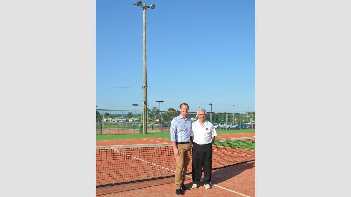 THANKS: Cessnock MP Clayton Barr and Cessnock Tennis Club president Michael Tsakissiris in front of the new power pole at Cessnock Tennis Courts on Saturday, October 10.