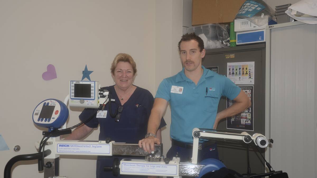 GRATEFUL: John Hunter Hospital case manager Jane Morison with 
physiotherapist Ryan Gallagher and the new motomed letto 2.  