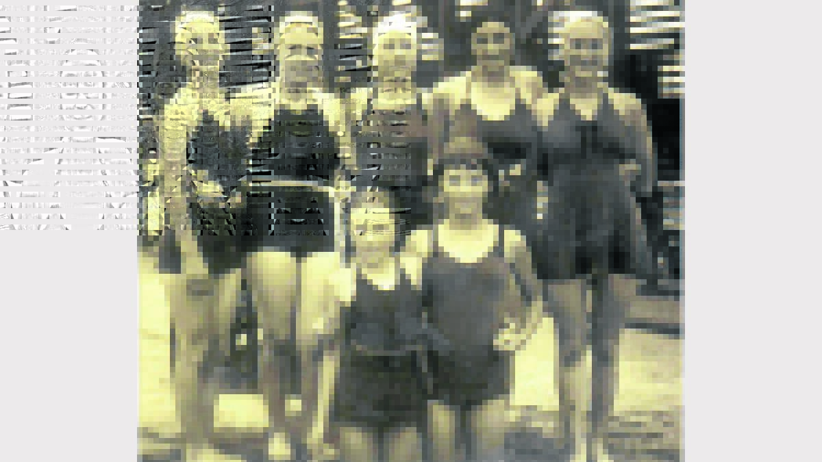 GOOD TIMES: Pictured at Cessnock Pool in 1935, Mavis Holland (back row, middle) and her sisters Daphne (back row, far right) and Elizabeth (front left). Do you know anyone in this picture? Contact The Advertiser on 4990 1244 to help us fill in the gaps.