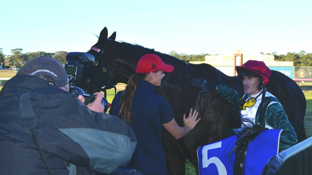Robert Thompson returns Youthful King to scale after riding to victory in the Jungle Juice Cup at Cessnock on July 1.
