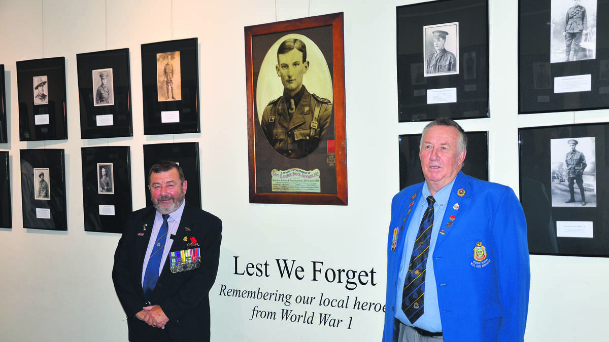 ANZAC: Cessnock RSL Sub-branch vice-president Tom Rutherford and Gregory Ingle, from the Kurri sub-branch, at the opening of Cessnock Library’s Lest We Forget exhibition.