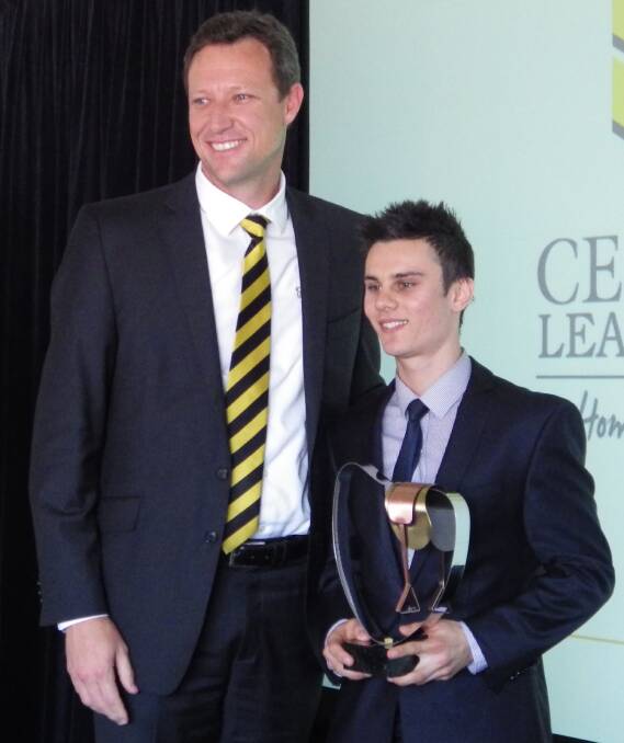 RISING STAR: Cessnock Leagues Club CEO, Paul Cousins presented Taylor Marshall with the apprentice’s premiership trophy.