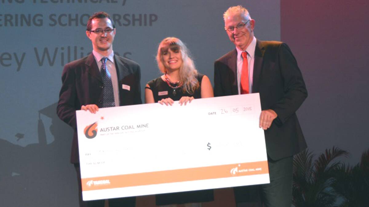 FINANCIAL BOOST: Kasey Williams (centre) accepting her scholarship from Yancoal Australia’s Austar Coal Mine representative Gary Mulhearn (left) and Cessnock Mayor Bob Pynsent in 2015.