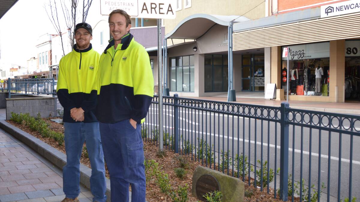 IMPROVEMENTS: Council workers Steve Cambridge and Matt Gordon in Vincent Street where the new trees were planted.