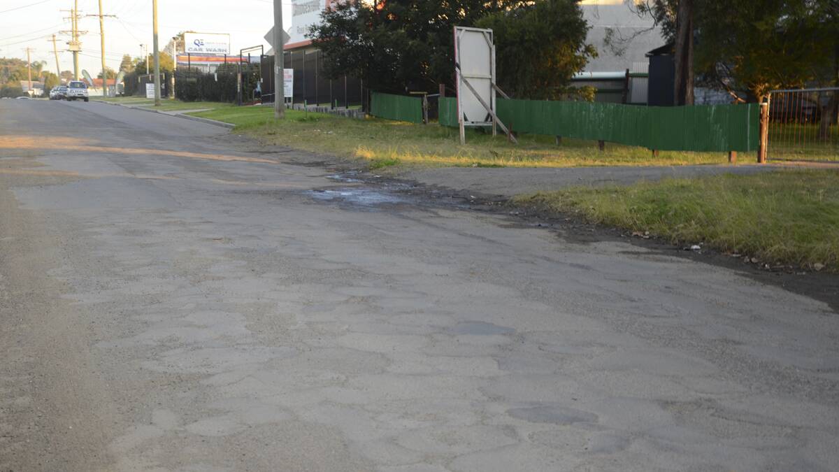 BUMPY RIDE: Wermol Street, Kurri, where Mr. Younes’s car wash is located, is also in poor condition.