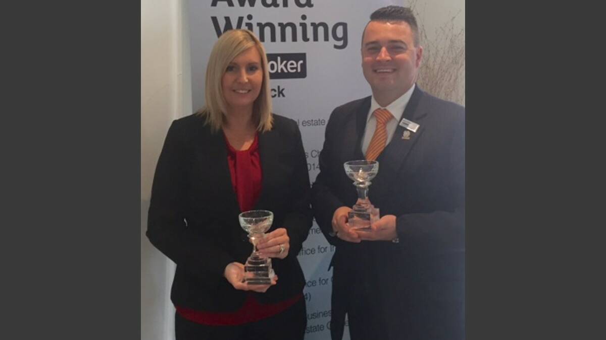 WINNERS: Mellissa and Bryce Gibson of LJ Hooker Cessnock and Kurri with their trophies from the EAC/REIA NSW Awards for Excellence.