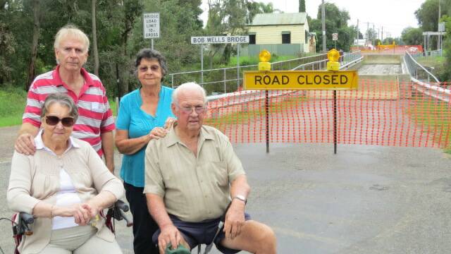 TAKING A STAND: Pictured at the now closed Bob Wells Bridge are Fourth Street residents Peter Toward and Freda Gilmour (front) with Marie and Errol Walker. 