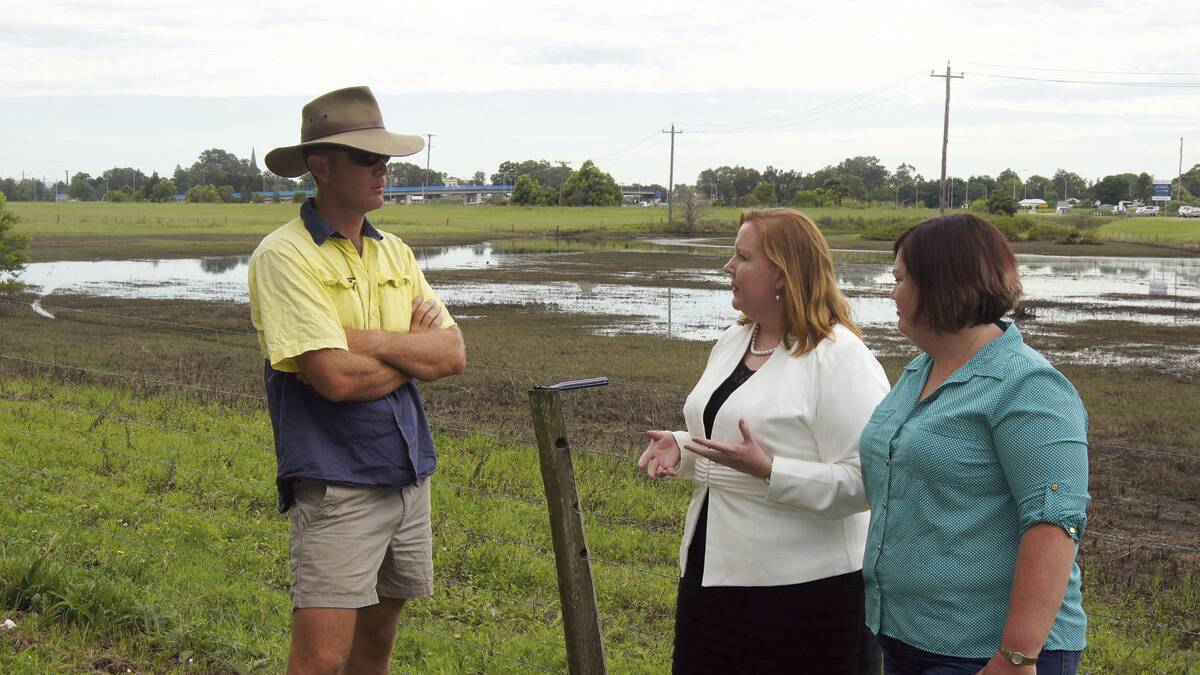 CONSUMERS WILL PAY:  Luke Dunford and Michelle Viola speak to Maitland MP Jenny Aitchison (centre) about the plight of small farm producers.  	Picture by BELINDA-JANE DAVIS