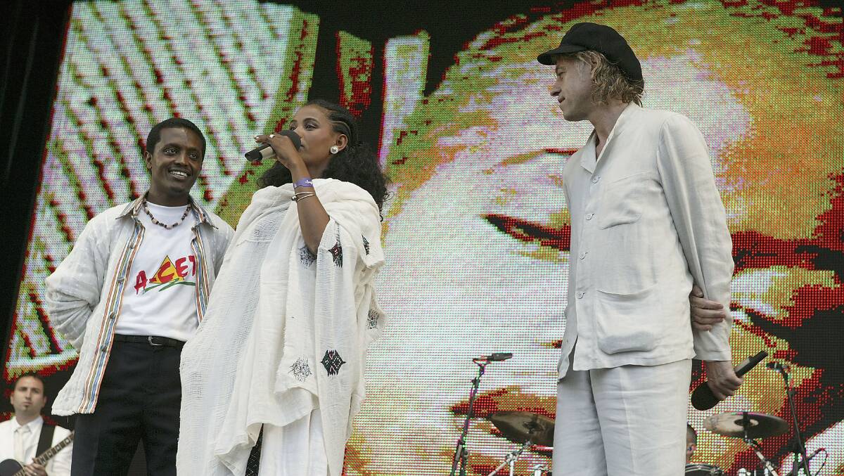 The 24-year-old student Birhan Woldu, former Ethiopian famine victim and the inspiration for Live Aid 1985, speaks on stage as Sir Bob Geldof looks on during 'Live 8 London' in Hyde Park on July 2, 2005 in London, England. Twenty years ago, Woldu's face was featured in a video at Live Aid as a dying child with only 10 minutes to live before she was saved by aid workers. Pic: Jo Hale/Getty Images