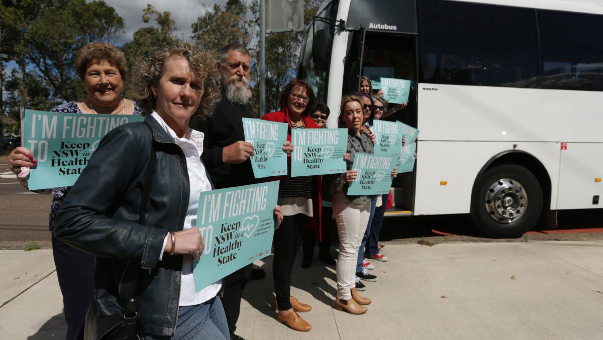 On the road: A convoy of buses and cars carrying dozens of Maitland residents and hospital staff went to NSW Parliament on Thursday to hear the debate over a petition calling for the new Maitland Hospital to be publicly run and funded. Picture: Simone De Peak 