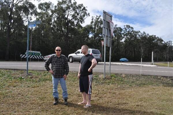 BLACK SPOT: Ricky Duncan and Matt Musgrove at the intersection of Duffie Drive and Maitland Road, where they are calling for a roundabout to be installed.