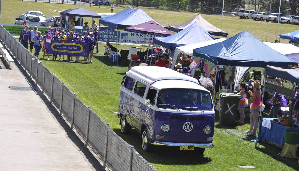CESSNOCK RELAY FOR LIFE 2013: Cancer survivors and carers walk the opening lap. Photo: The Advertiser.
