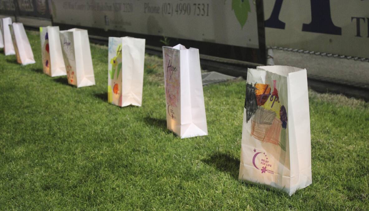 CESSNOCK RELAY FOR LIFE 2013: Candle bags lined the track for the ceremony of remembrance. Photo: Lauren Woolley.