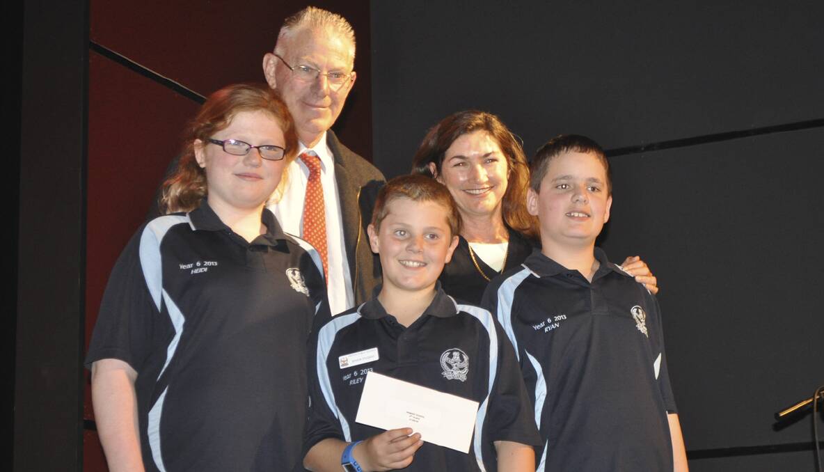 The Paxton team (Heidi Turner, Riley Kuosman and Ryan Dixon) collect their $1000 prize for third place from Cessnock Mayor Bob Pynsent and Hunter Resource Recovery education officer Leanne Sanderson.