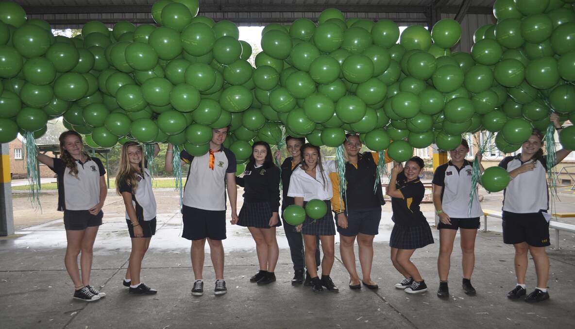 GESTURE: Cessnock High School students Bethany Roden, Jade Earl, Shane Wilson, Justice Ward, Brianna Dunnicliff, Monique Cameron, Annabelle Judge, Yasmin Williams, Jessica Mascord, Courtney Fox getting ready to release the balloons.
