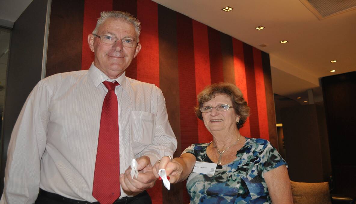 PLEDGE: Mayor of Cessnock, Cr. Bob Pynsent and BPW Cessnock president Sheila Turnbull with their white ribbons.