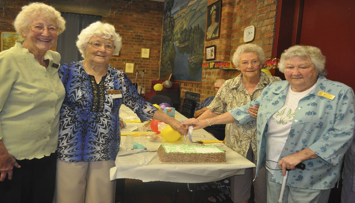 CELEBRATION: Four of CPSCA’s longest serving members, Mavis Vernon, Fay Ingram, Beryl Snaddon and Betty Earl, cutting the 80th birthday cake. All four have been members of the association for more than 25 years. 