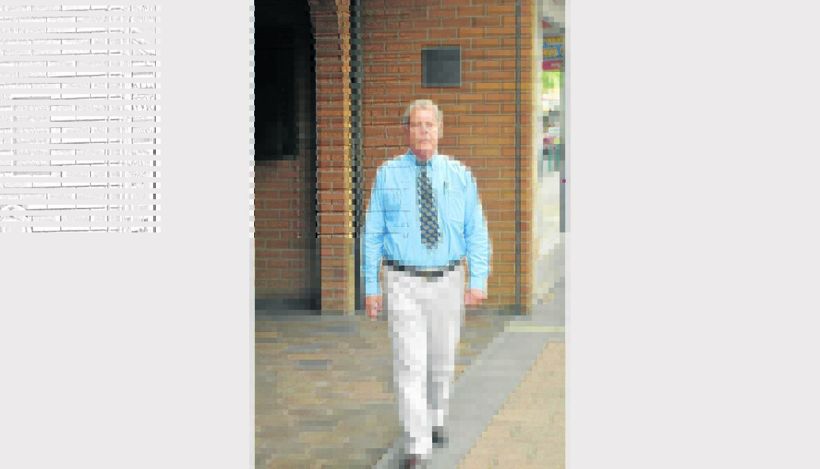 MEMORIES: Peter Cleaves takes a walk past his former office in Vincent Street.