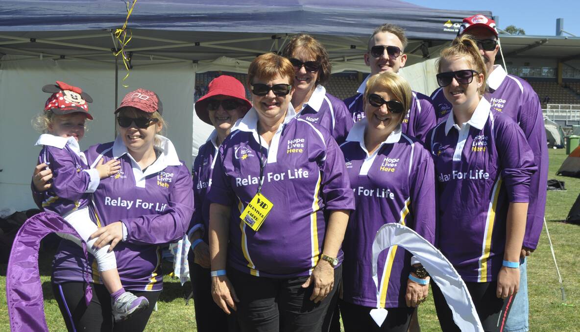 CESSNOCK RELAY FOR LIFE 2013: Auscoal Family Ties team members Hannah Hickey-Attewell, Arna Hickey, Ros Radoll, Nadine Hickey, Lynda Thompson, Cindy Thompson, Dylan Thompson, Madeline Thompson and David Thompson, who walked in memory of Gareth Hickey. Photo: The Advertiser.