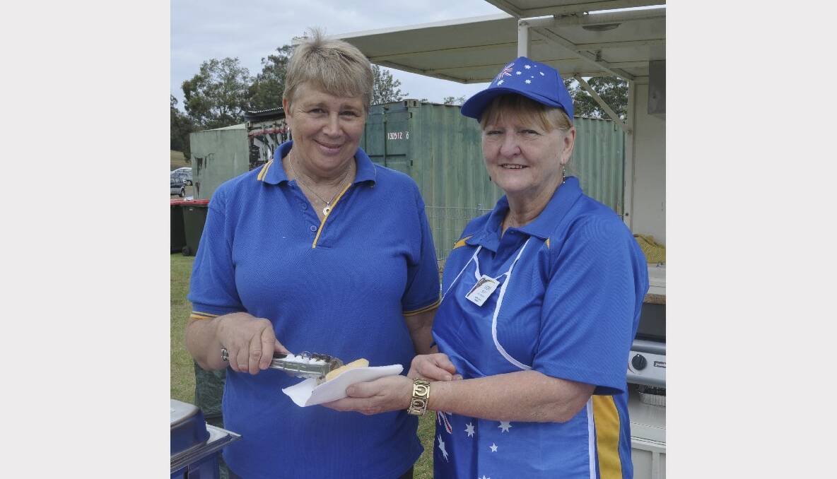 Val Calvey and Vicki Steep from Cessnock Rotary Club, cooking up a storm at the Australia Day barbecue breakfast at East End Oval.
