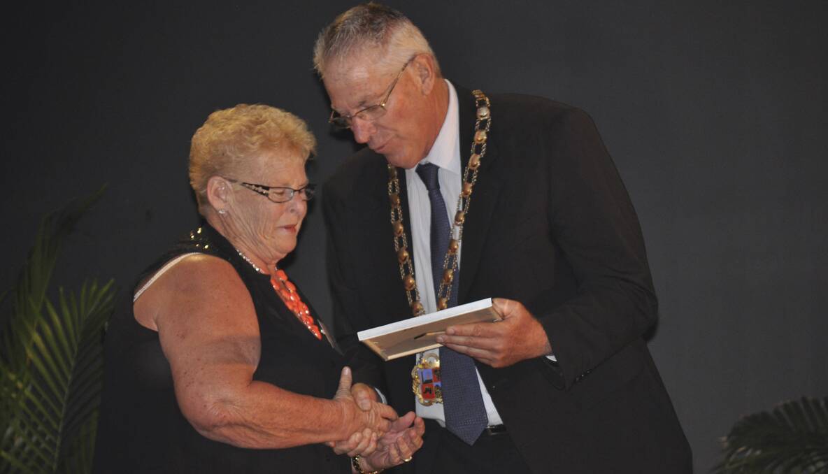 Cessnock City Citizen of the Year, Ellena Morris receives her Australia Day award from Cessnock mayor Bob Pynsent.