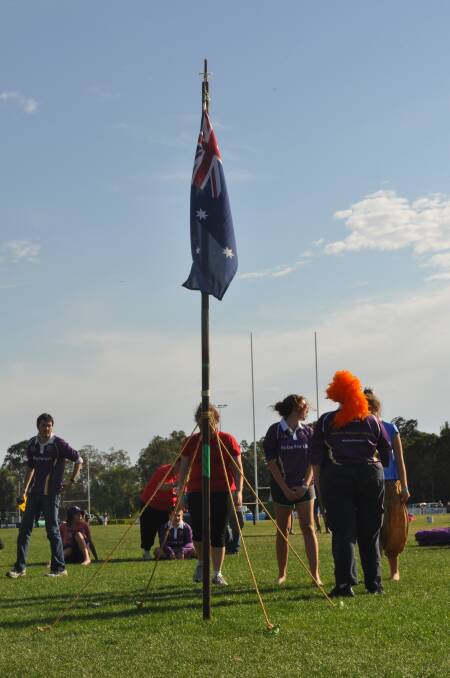 CESSNOCK RELAY FOR LIFE 2013: The Cessnock Girl Guides lower the Australian flag as the Relay comes to a close. Photo: The Advertiser.