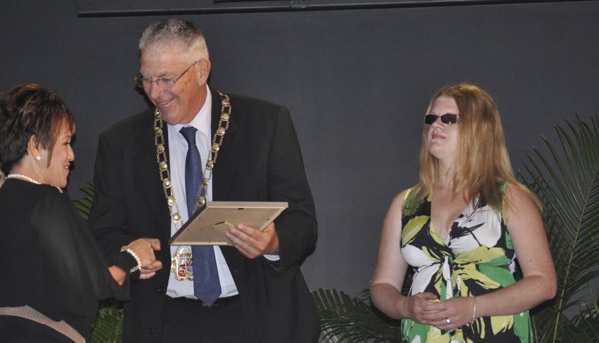 Maria Hardy receives her appreciation award from Cessnock Mayor Bob Pynsent and ambassador Krystel Keller.
