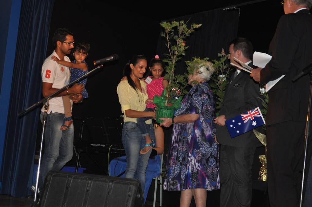 Cessnock City councillors presented the new citizens with a native plant.