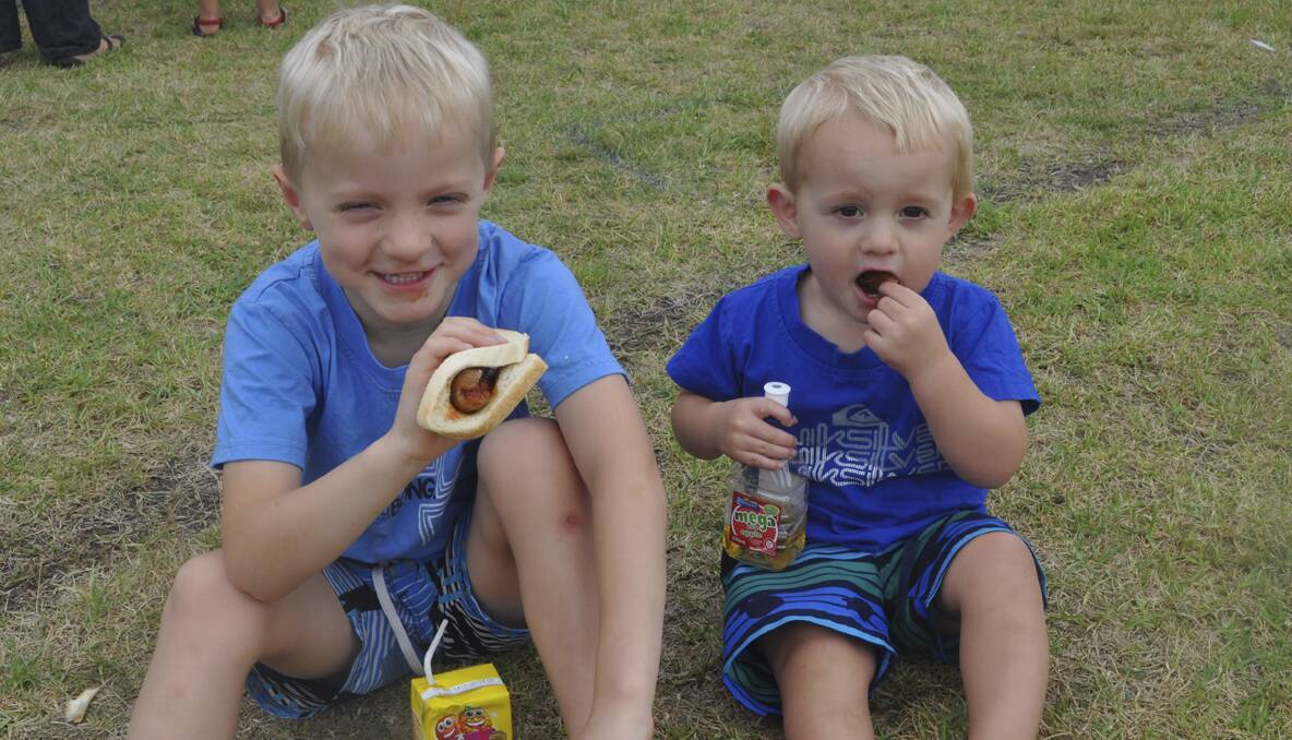The Slade brothers William (5) and Oscar (almost 2), of Paxton, enjoying the Australia Day breakfast at East End Oval.