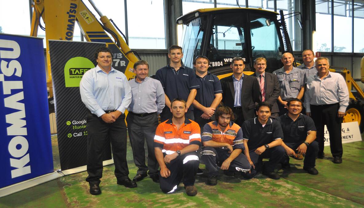 PARTNERSHIP: Pictured (back row) is Komatsu’s Craig Burgess, Development Manager Paul Richardson, apprentices Michael Flemming and Nathan Dowse, General Manager Cameron Ballentine-Jones, Hunter TAFE Faculty Director Rob Wolter, Kurri TAFE head teacher in plant mechanics Mark Osterman, Scott Cassin and Gavin Manning from Hunter Komatsu; (front) Komatsu apprentices Scott Waller,  Chris Sattler, Rene Morales and Ronald Canada. 