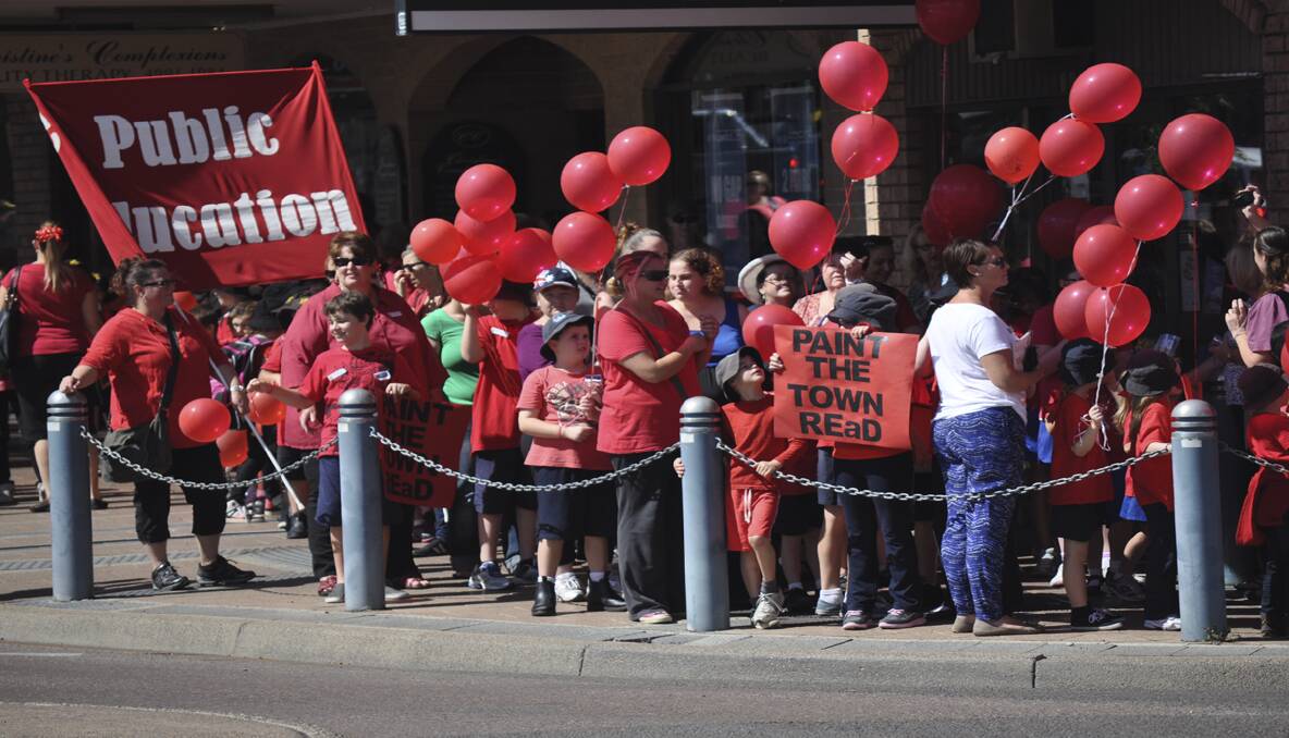 Students and teachers dressed in red takeover the main streets of Cessnock. 