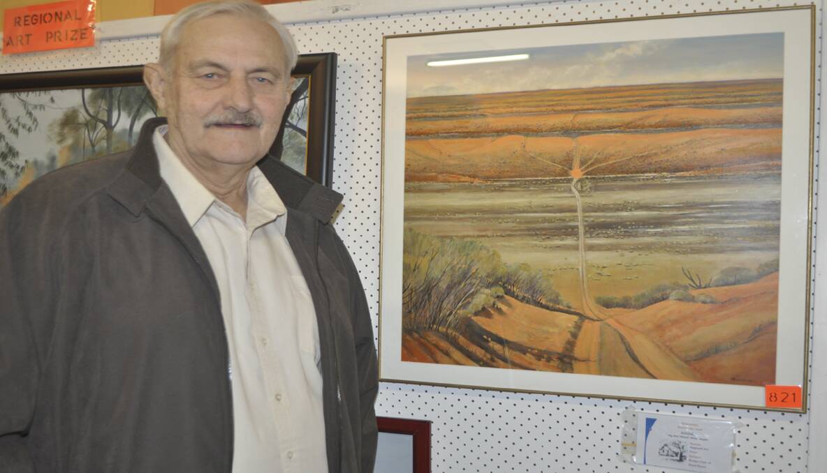 Artist Bruce Naylor and his piece ‘Big Red Ahead’, winner of the Regional Art Prize. 