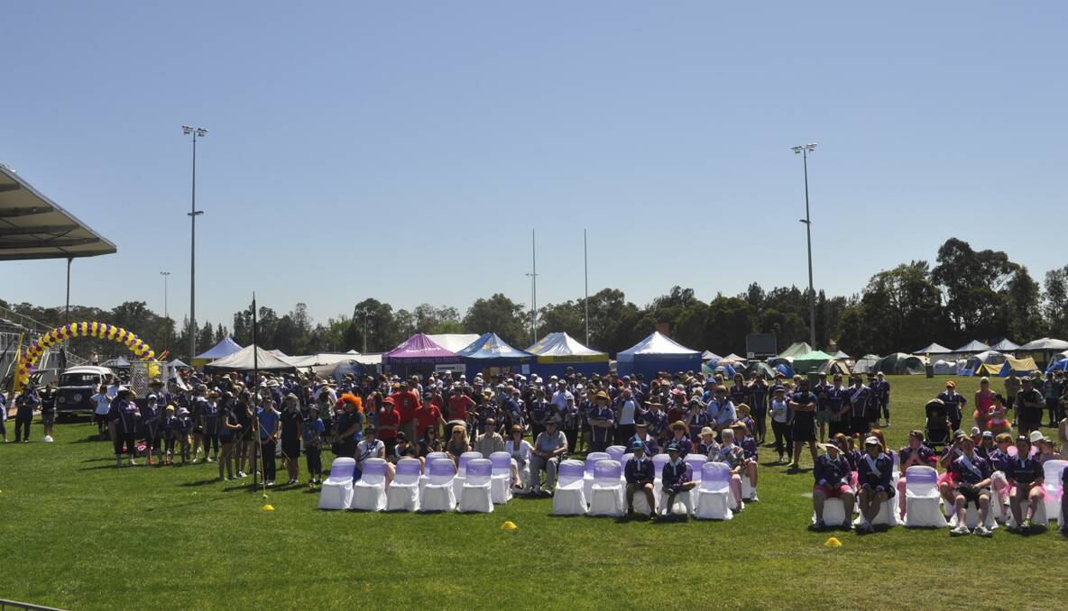 CESSNOCK RELAY FOR LIFE 2013: Relayers gather for the opening ceremony at Baddeley Park. Photo: The Advertiser.