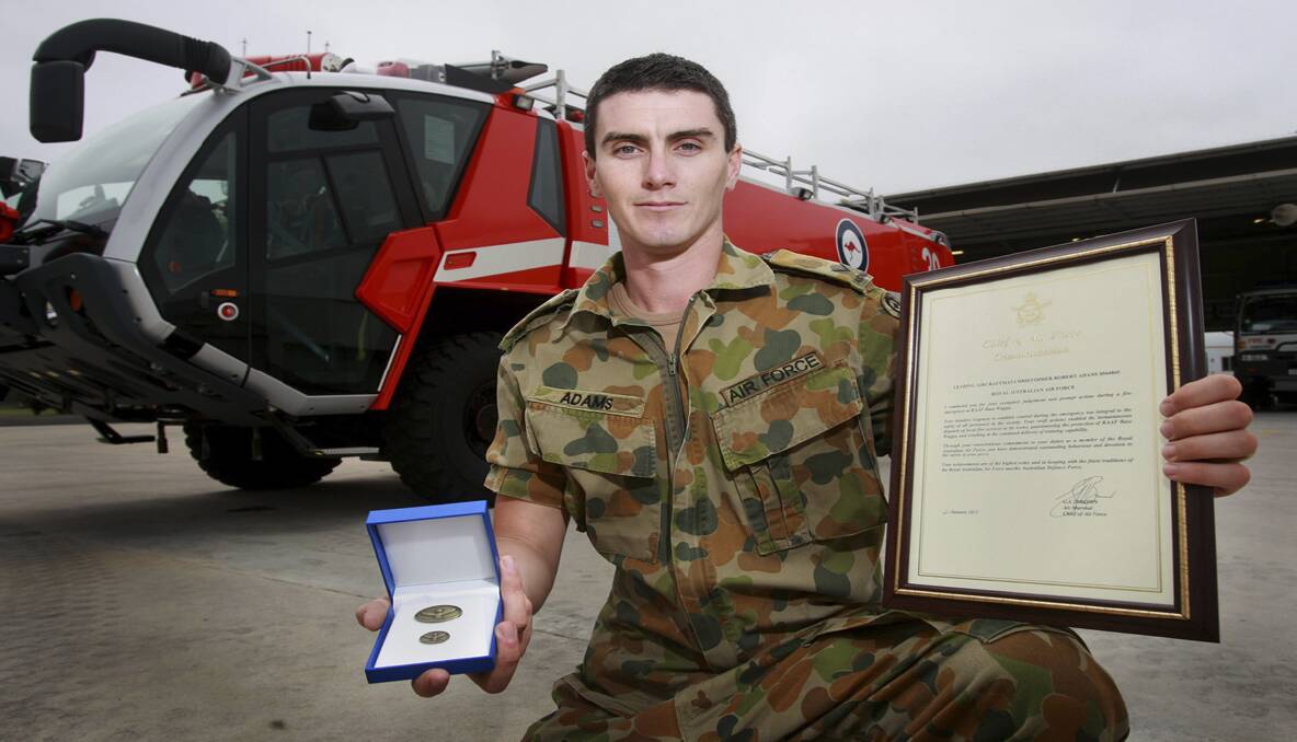 SURPRISED: Leading Aircraftman Chris Adams (of Cessnock) with his commendation award.