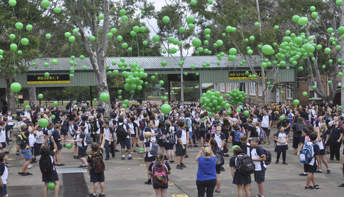 RELEASE: Cessnock High School students and teachers release green balloons in support of the anti-bullying pledge. 