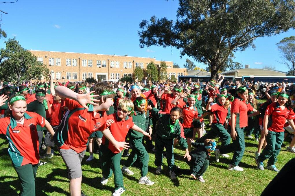 About 1000 students from the Cessnock Community of Great Public Schools took part in a flash mob at the Cessnock TAFE grounds on Monday, July 30. 